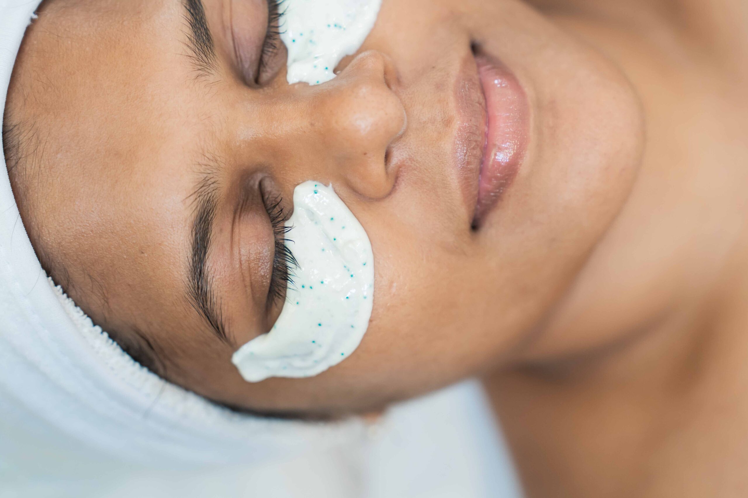 Casmara Eye Perfection Treatment at Mackcare Skin Clinic. Client relaxes with a hydrating white under-eye mask for a brighter, revitalized look.