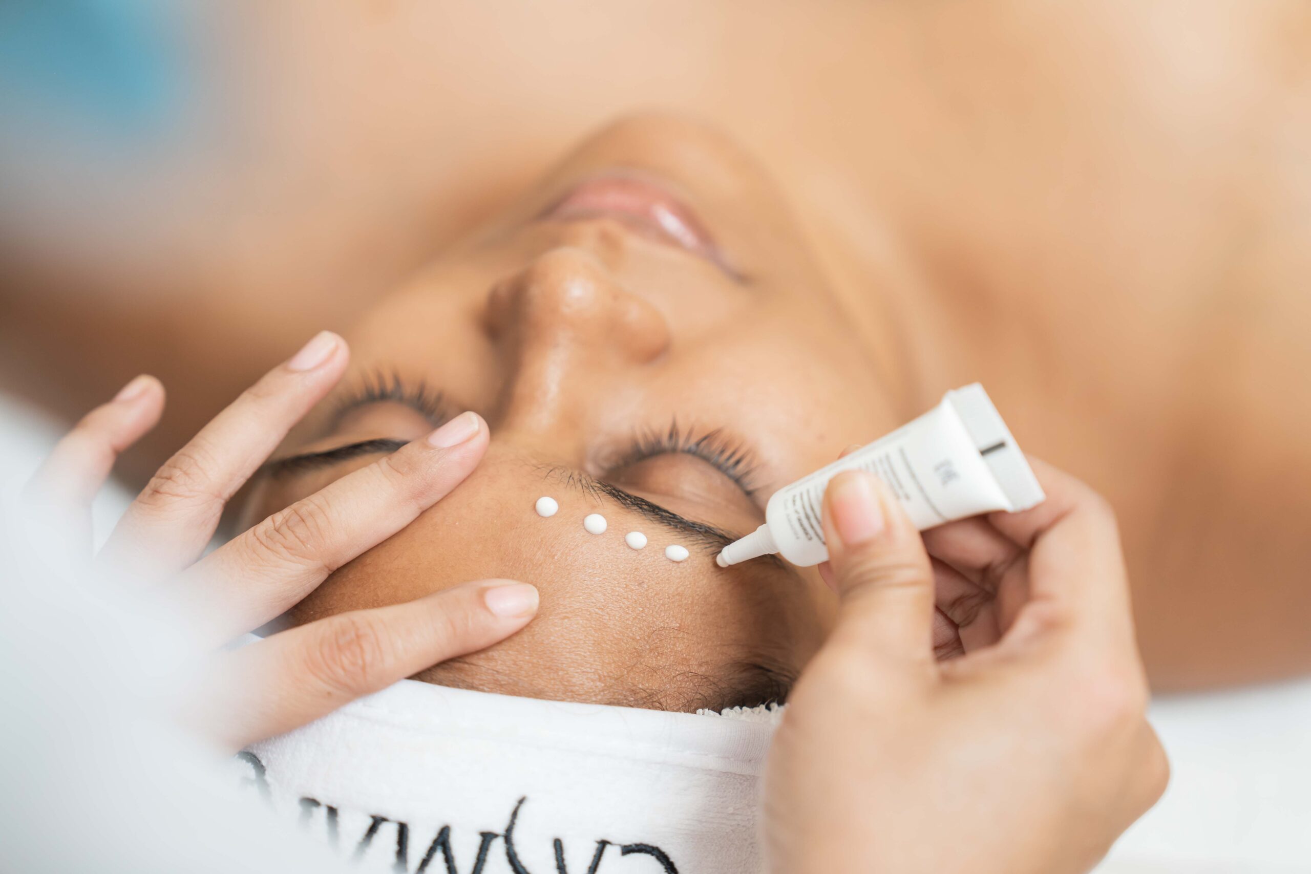 Casmara eye treatment at Mackcare Skin Clinic. Aesthetician applies Casmara product for brow enhancement.